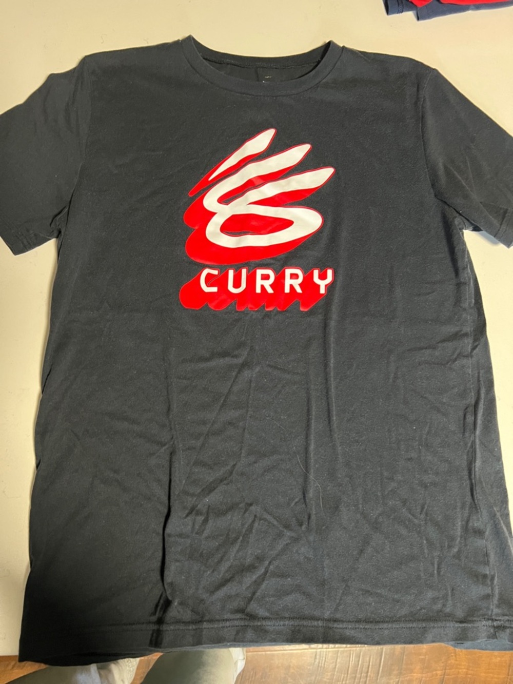 Under Armour Black Tee with Red and White Curry Logo